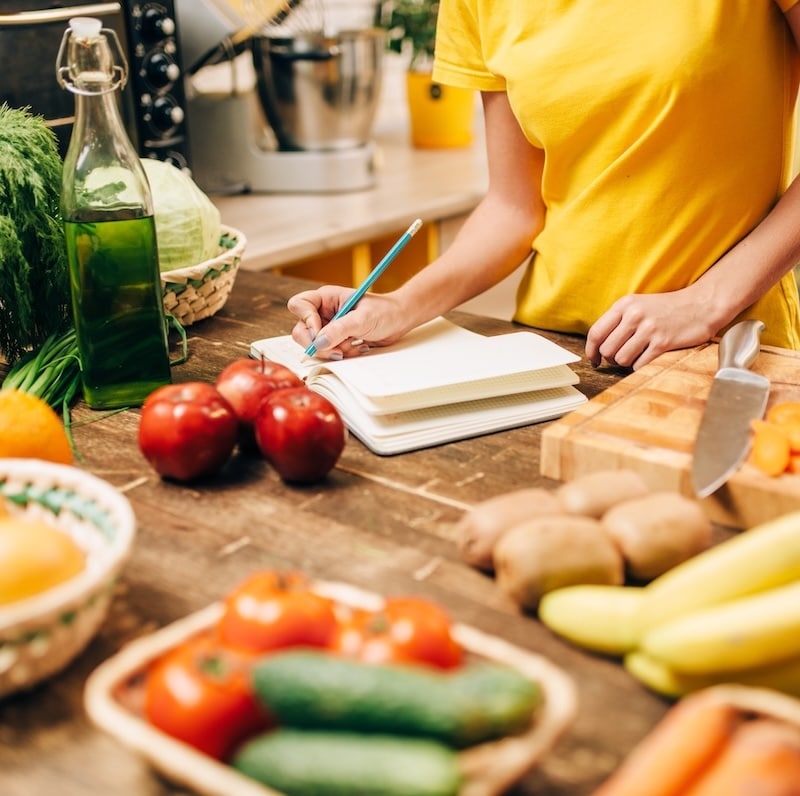 Female person cooking on the kitchen, bio food